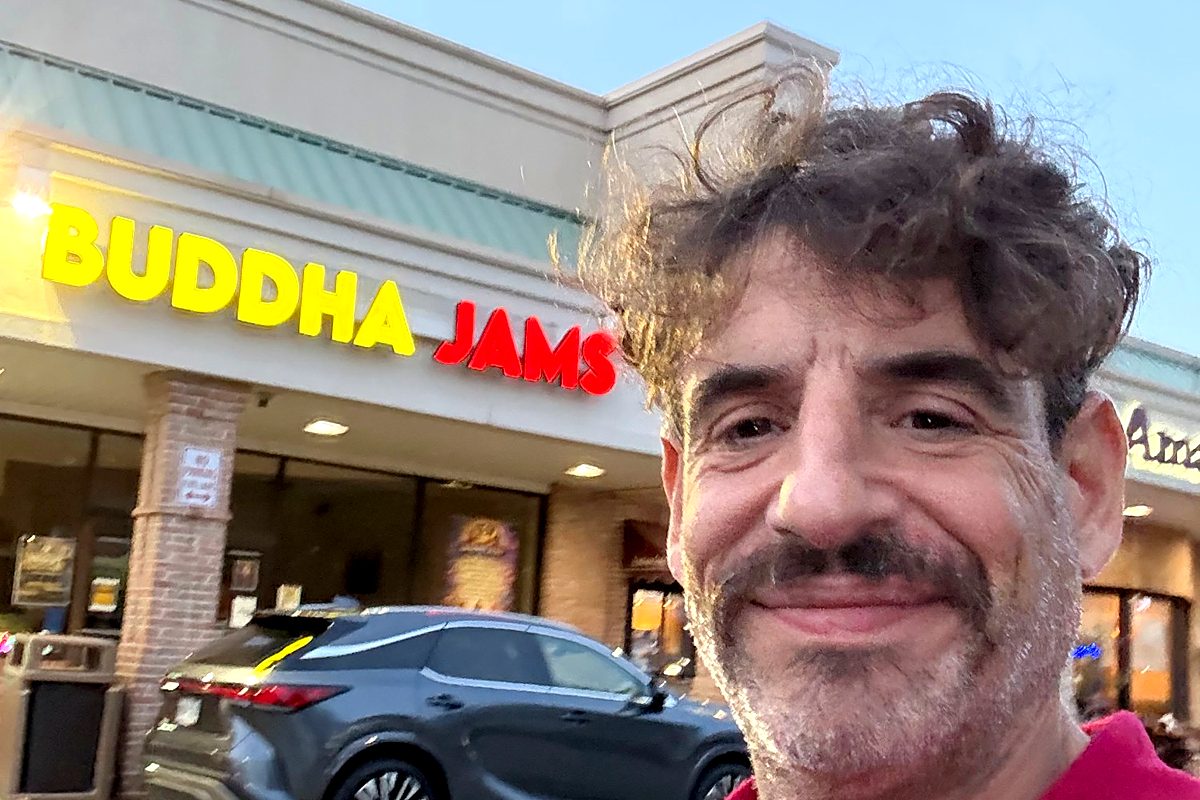 The Buddha Jams storefront, with its yellow and red sign